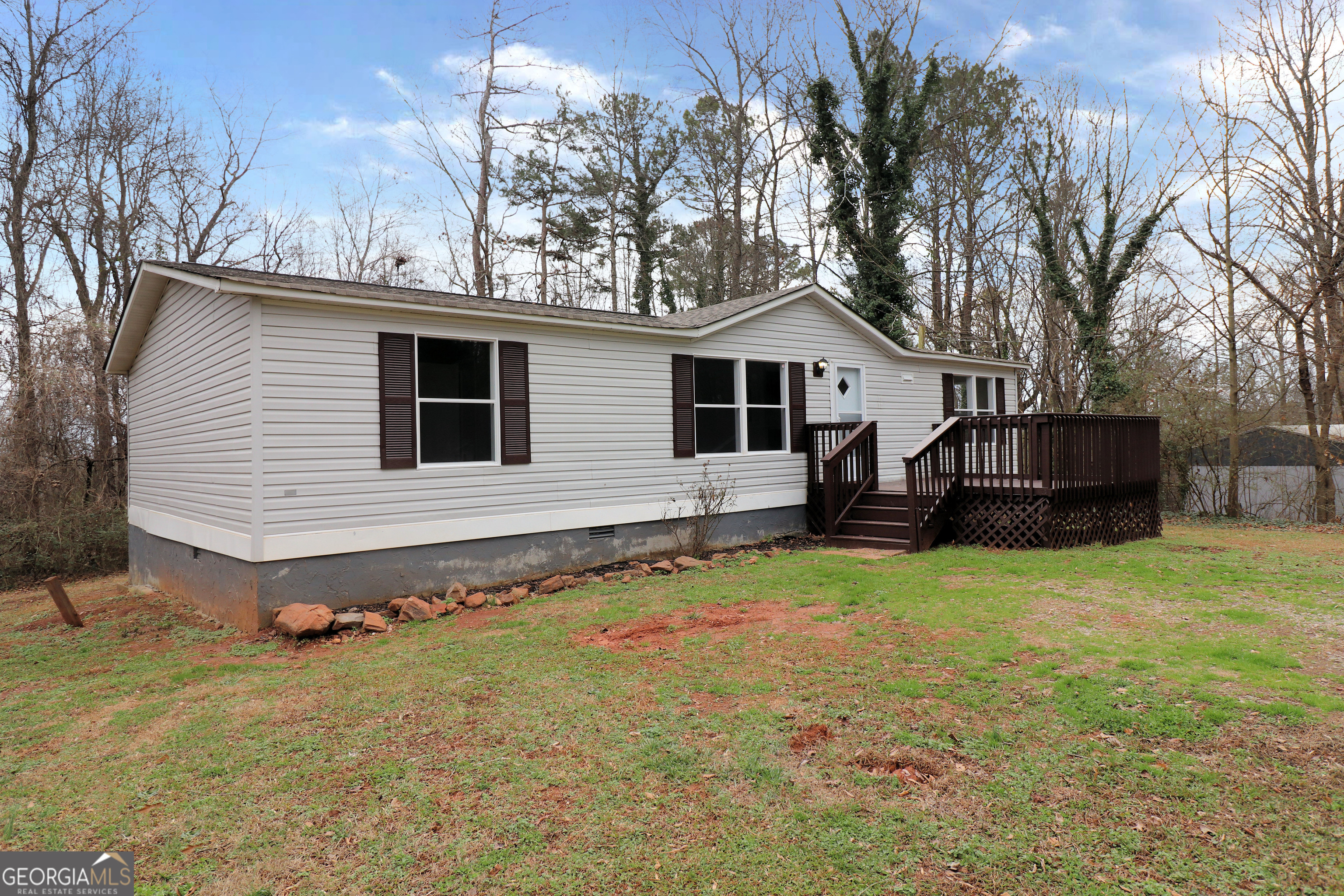 2200 Ridgeside Drive Villa Rica, GA 30180 - Photo 2 of 32 a backyard of a house with table and chairs