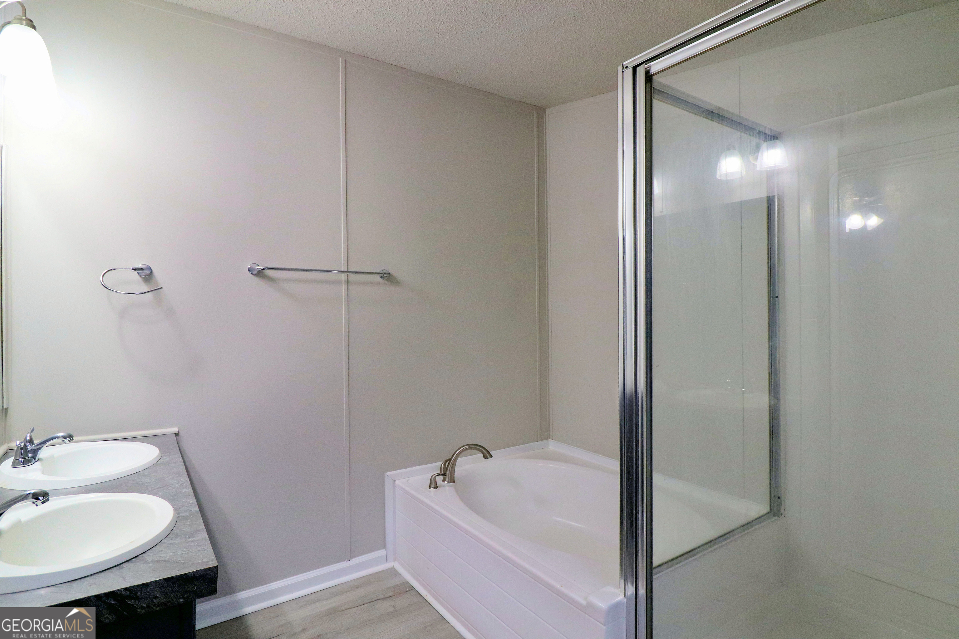 2200 Ridgeside Drive Villa Rica, GA 30180 - Photo 22 of 32 a bathroom with a tub sink and mirror