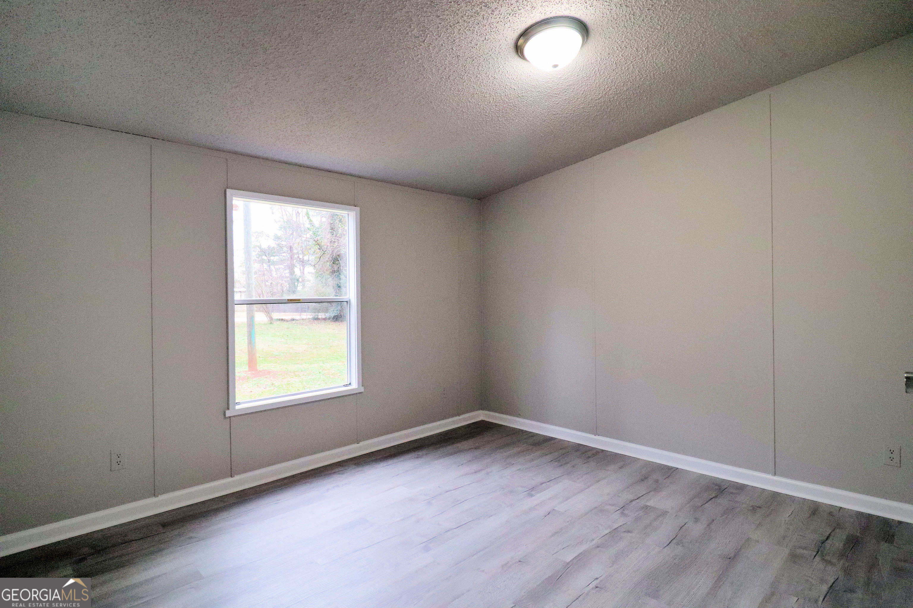 2200 Ridgeside Drive Villa Rica, GA 30180 - Photo 24 of 32 an empty room with a window