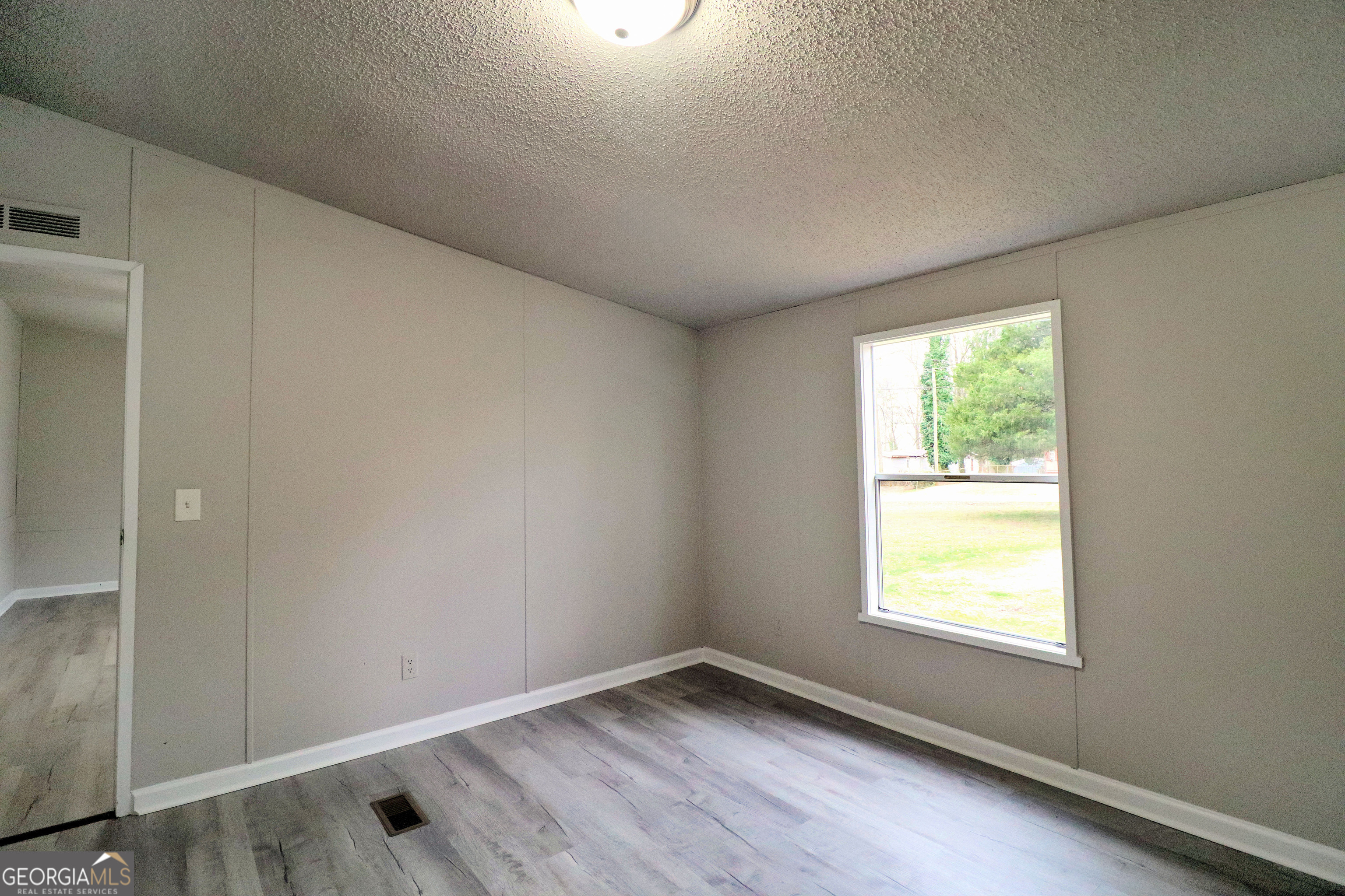 2200 Ridgeside Drive Villa Rica, GA 30180 - Photo 27 of 32 an empty room with a window