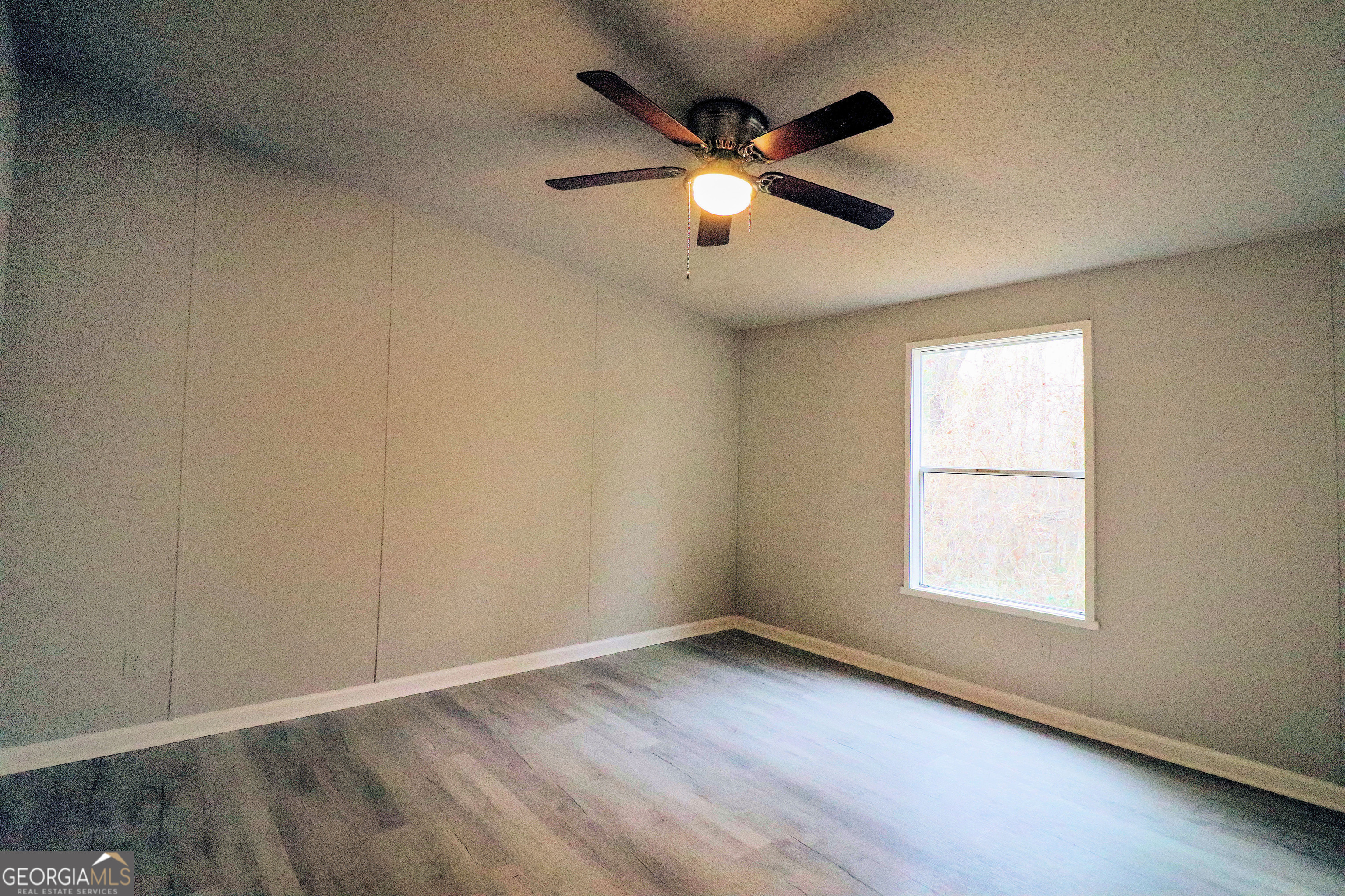 2200 Ridgeside Drive Villa Rica, GA 30180 - Photo 28 of 32 wooden floor in an empty room with a window