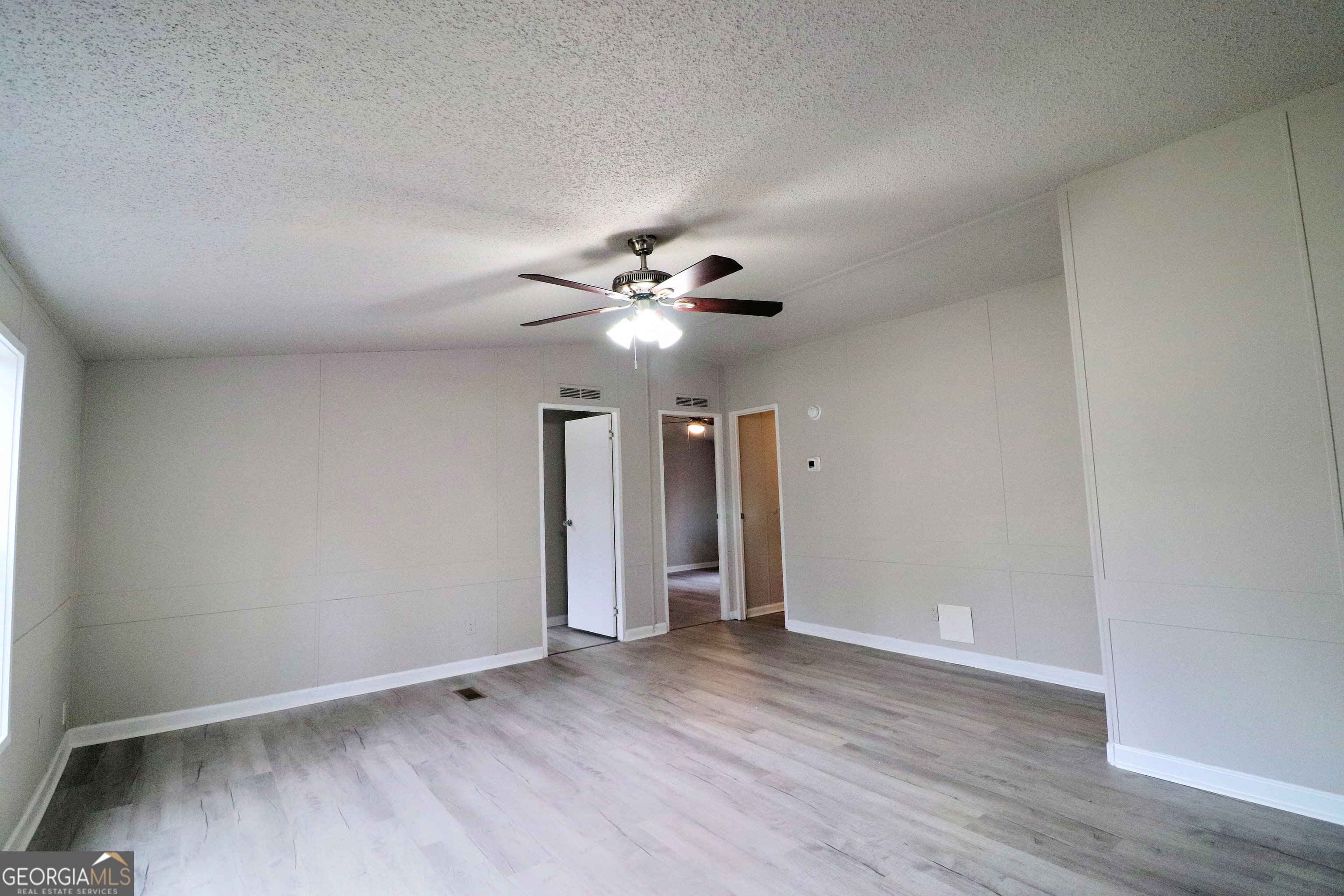 2200 Ridgeside Drive Villa Rica, GA 30180 - Photo 5 of 32 a view of an empty room with wooden floor