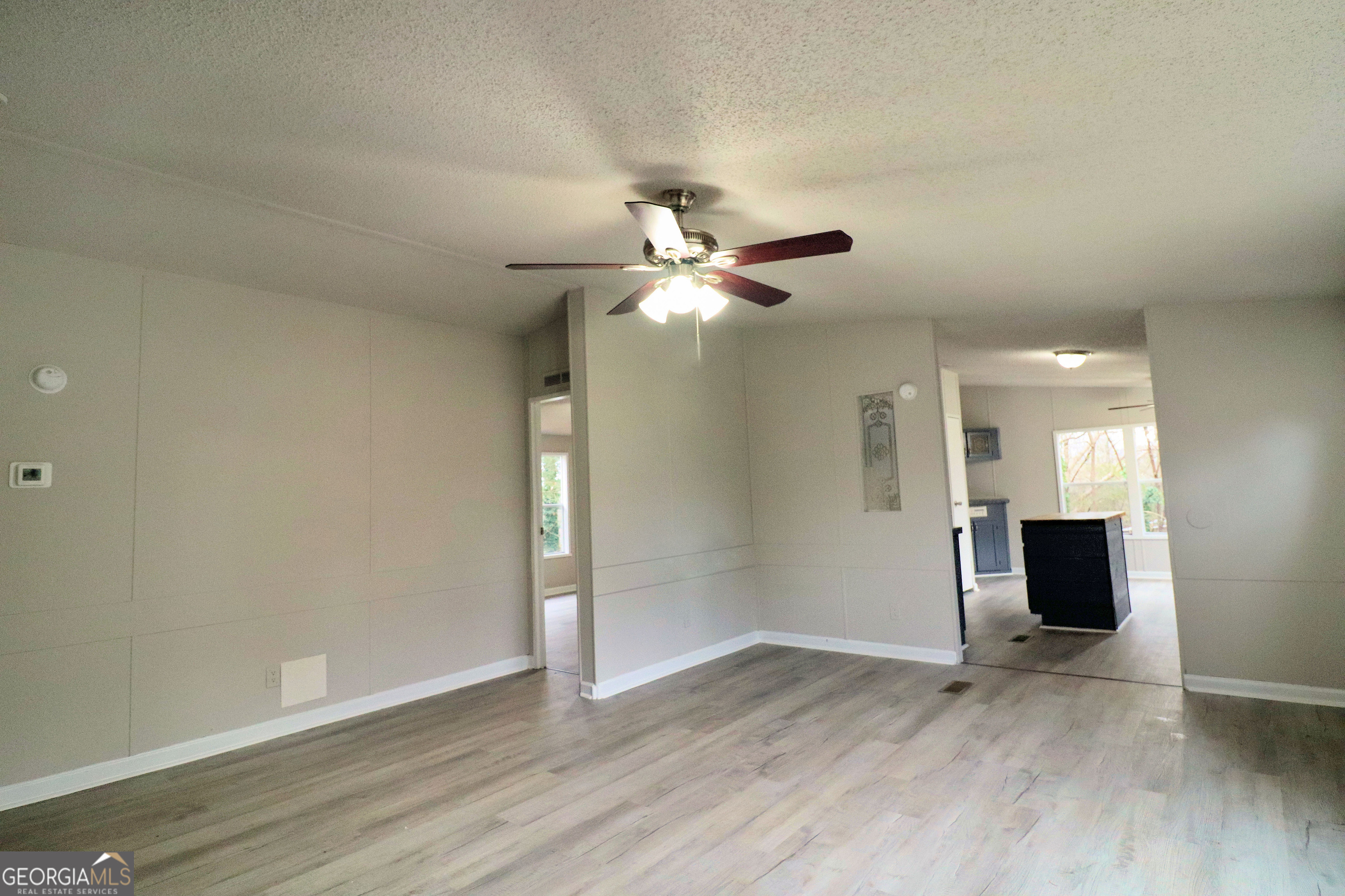 2200 Ridgeside Drive Villa Rica, GA 30180 - Photo 6 of 32 wooden floor in an empty room with a window