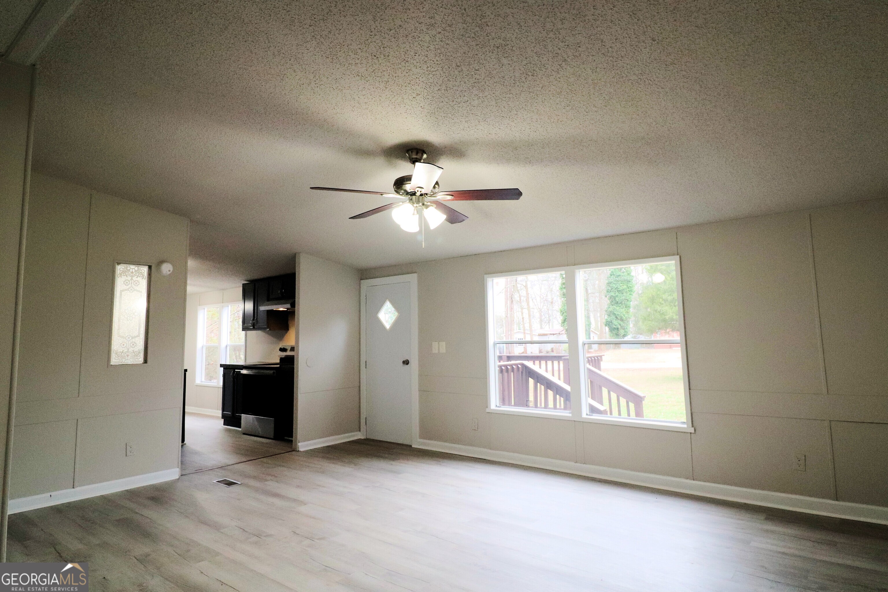 2200 Ridgeside Drive Villa Rica, GA 30180 - Photo 8 of 32 an empty room with windows and cabinet
