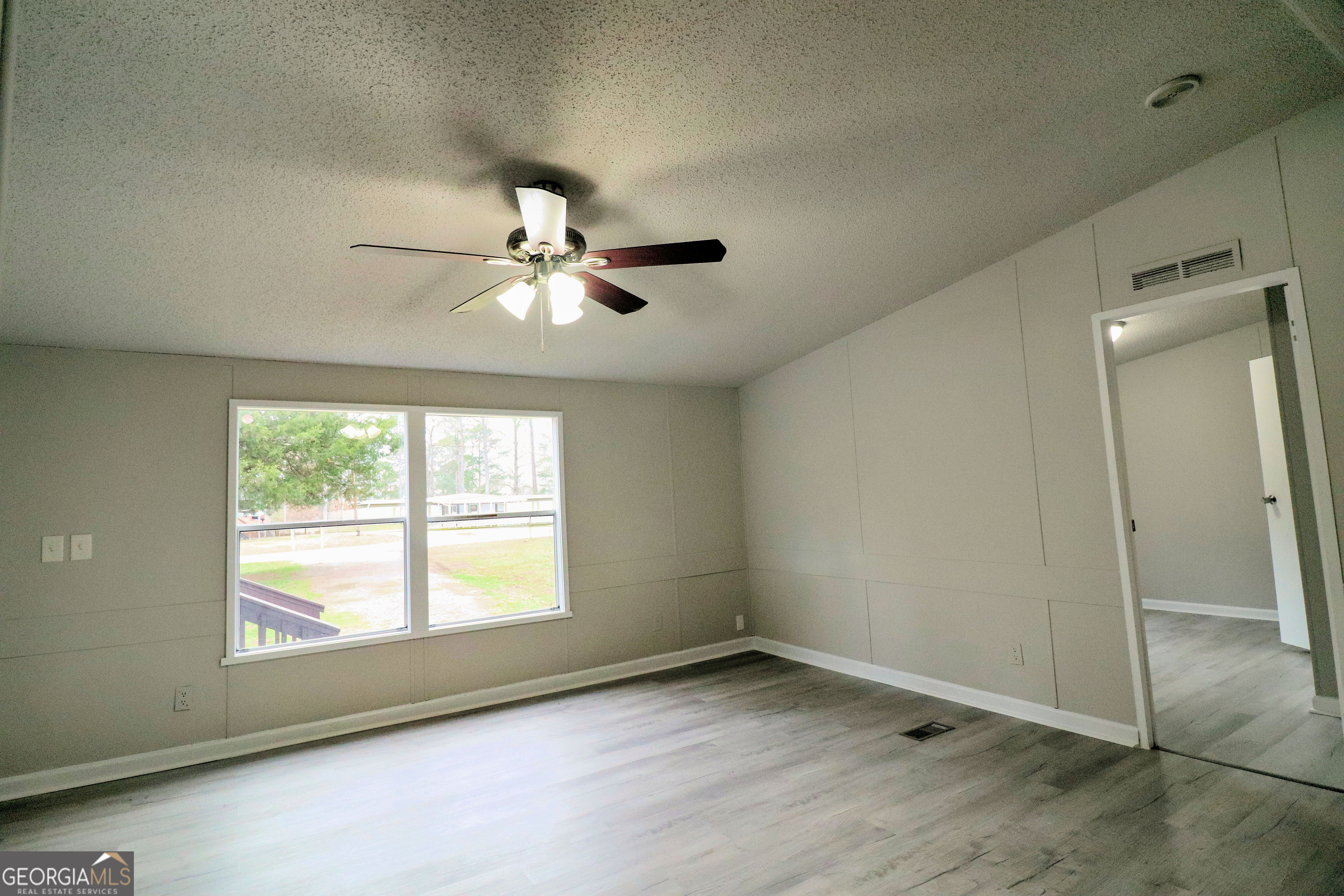 2200 Ridgeside Drive Villa Rica, GA 30180 - Photo 9 of 32 an empty room with windows and fan
