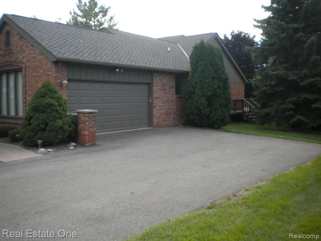 36615 Valley Ridge Drive Farmington, MI 48331 - Photo 9 of 51 Side access...giant long driveway, elec opener, keypad entry, 2+ car garage