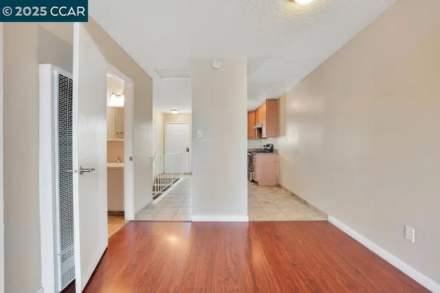 a view of a hallway view with wooden floor and staircase