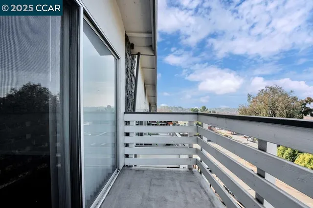 a view of balcony with furniture