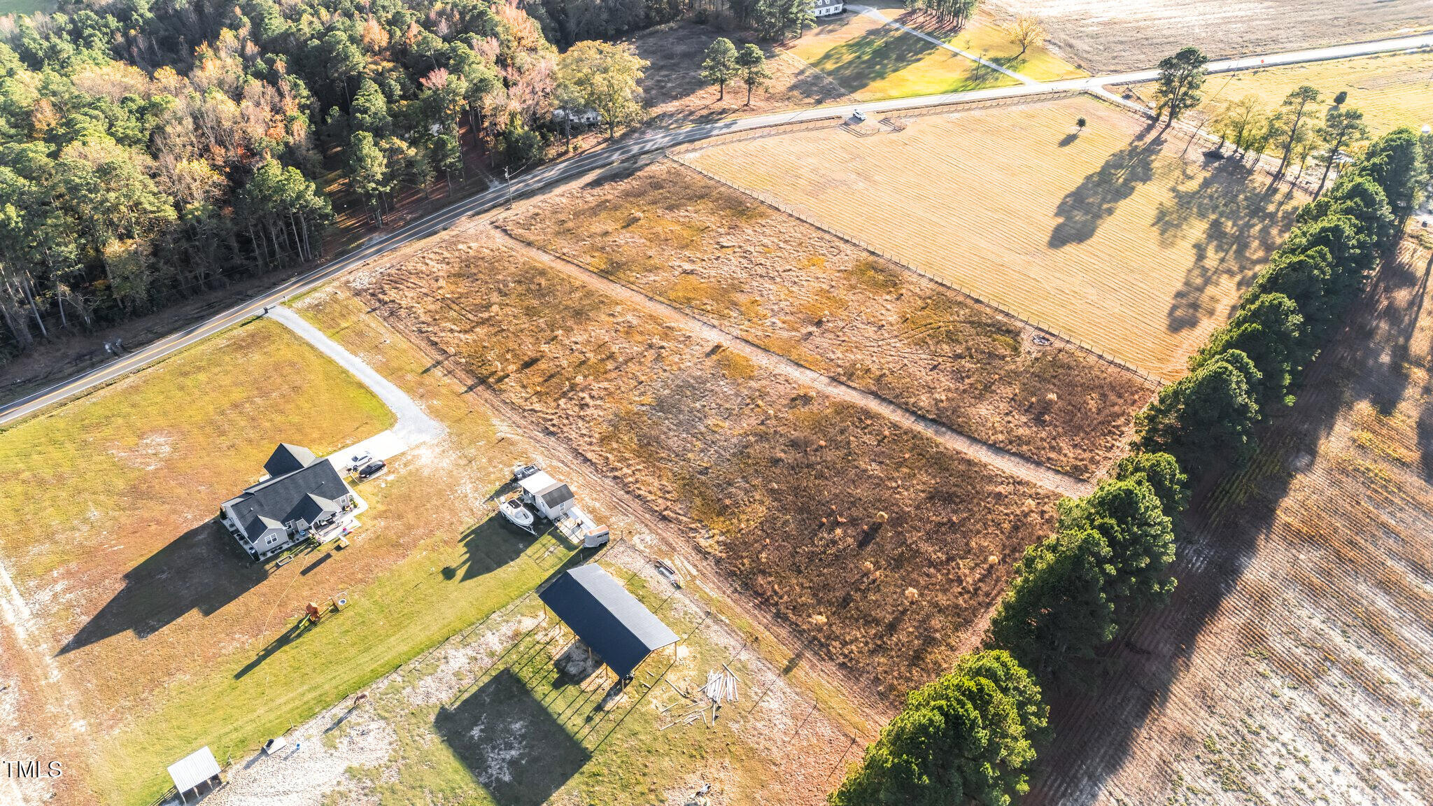 3030 Godwin Lake Road Benson, NC 27504 - Photo 18 of 18 a view of a yard with street