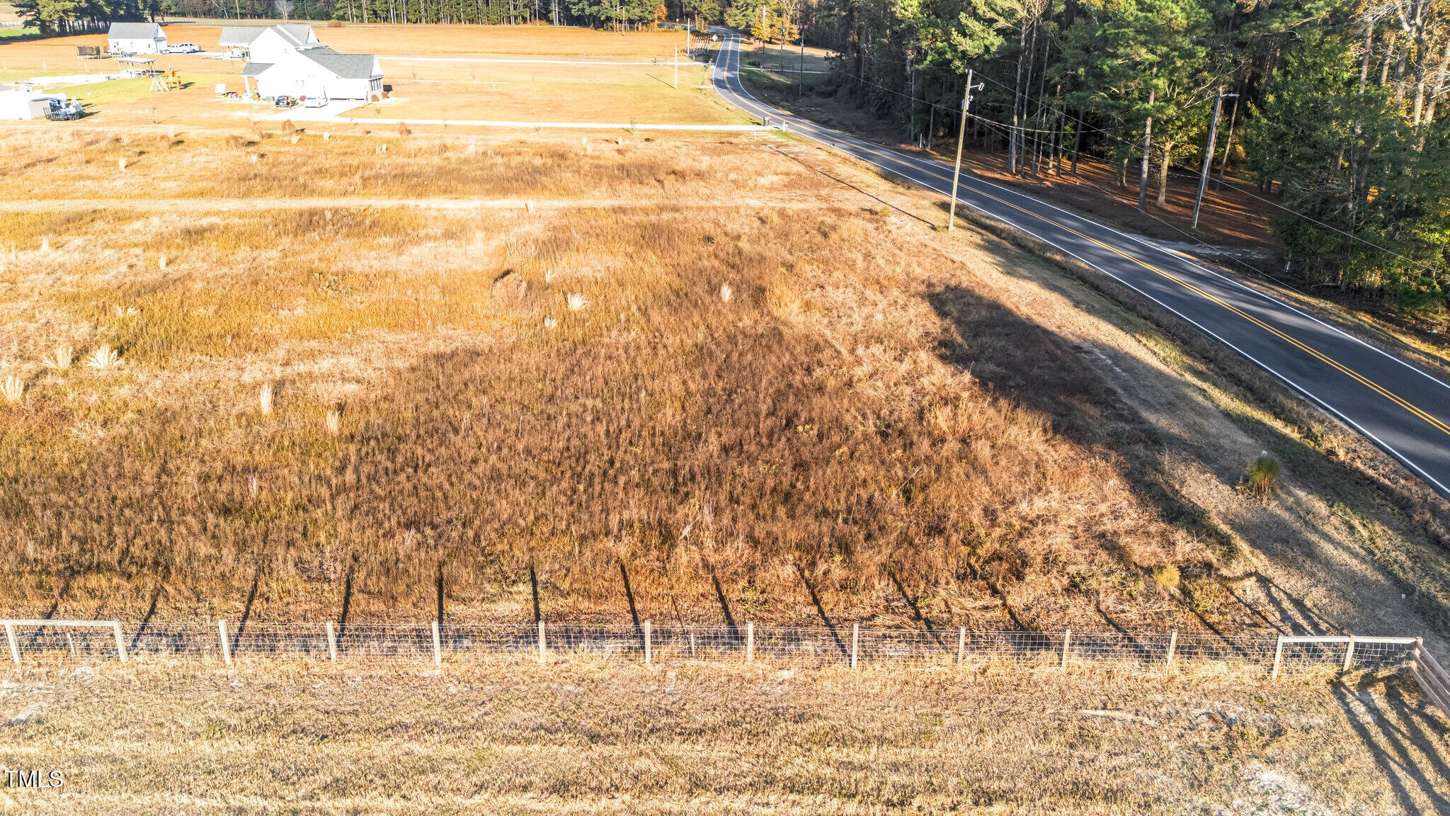 3030 Godwin Lake Road Benson, NC 27504 - Photo 6 of 18 a view of yard with wooden fence