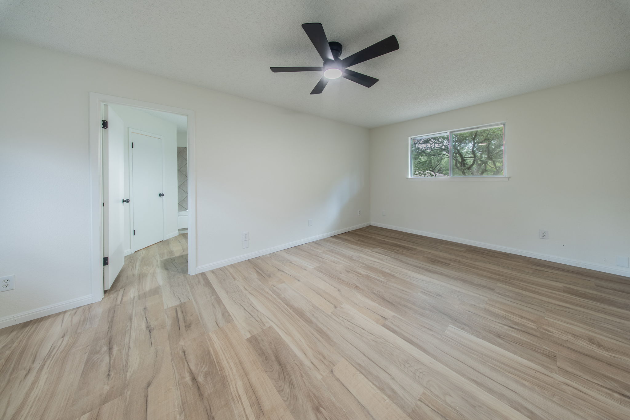 4504 Langtry Lane Austin, TX 78749 - Photo 18 of 24 A quiet retreat with durable flooring and ample natural light, creating a serene personal space.
