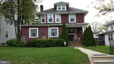 602 Brookwood Road Baltimore, MD 21229 - Photo 1 of 7 a front view of a house with garden