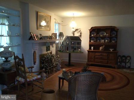 602 Brookwood Road Baltimore, MD 21229 - Photo 3 of 7 a living room with furniture and a fireplace