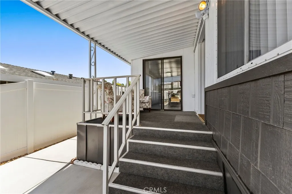 4000 Pierce Street, Unit 132 Riverside, CA 92505 - Photo 5 of 43 a view of entryway with wooden floor and stairs