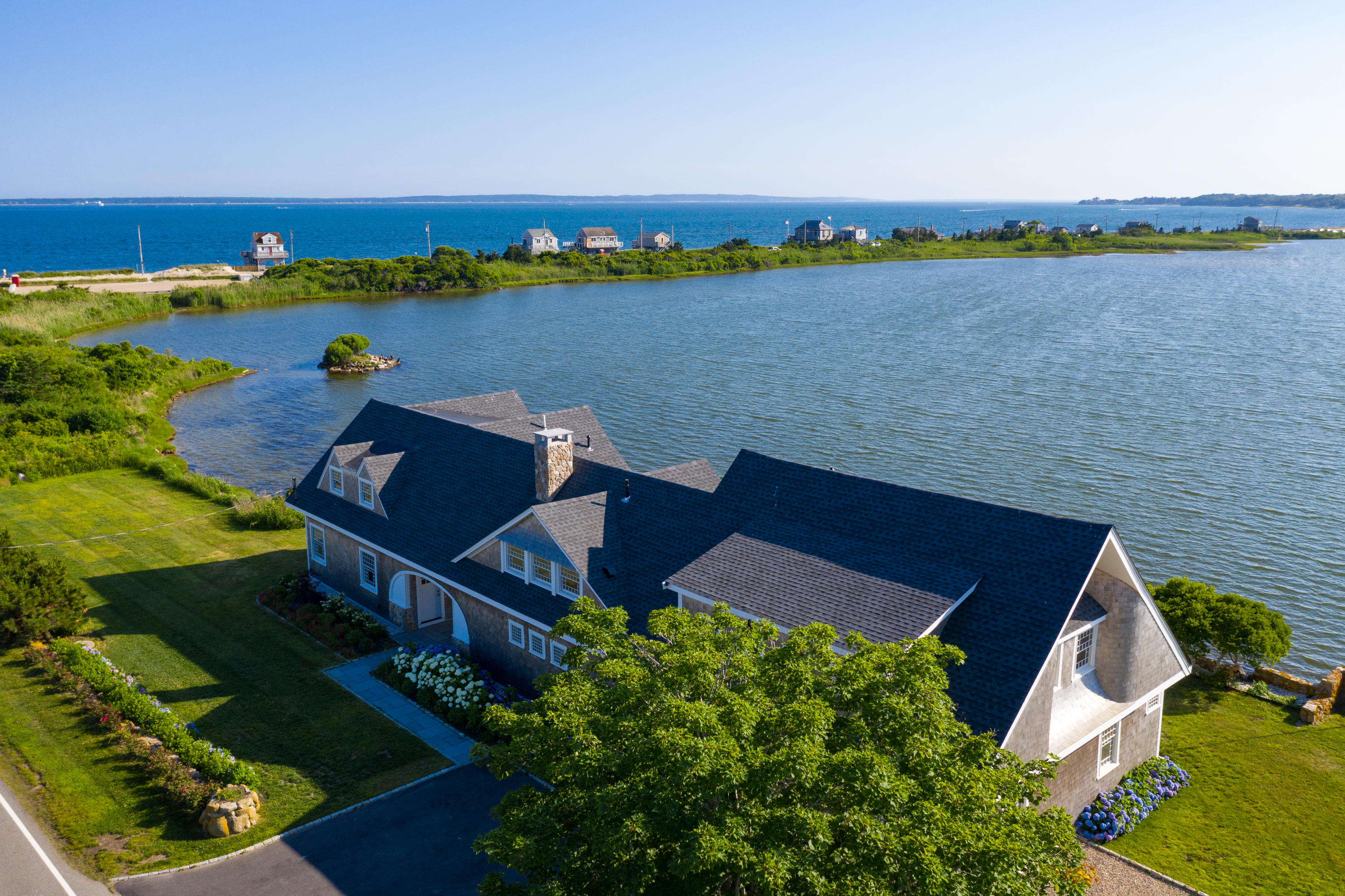 333 Mill Road Falmouth, MA 02540 - Photo 11 of 68 an aerial view of a house with a lake view