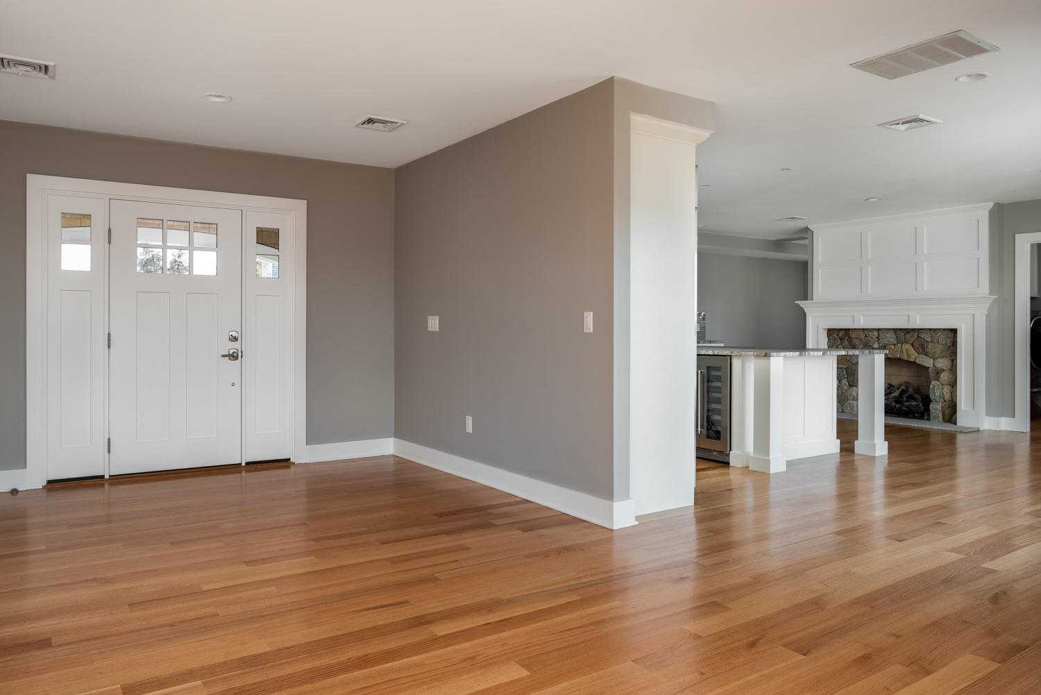 333 Mill Road Falmouth, MA 02540 - Photo 14 of 68 an empty room with wooden floor fireplace and windows