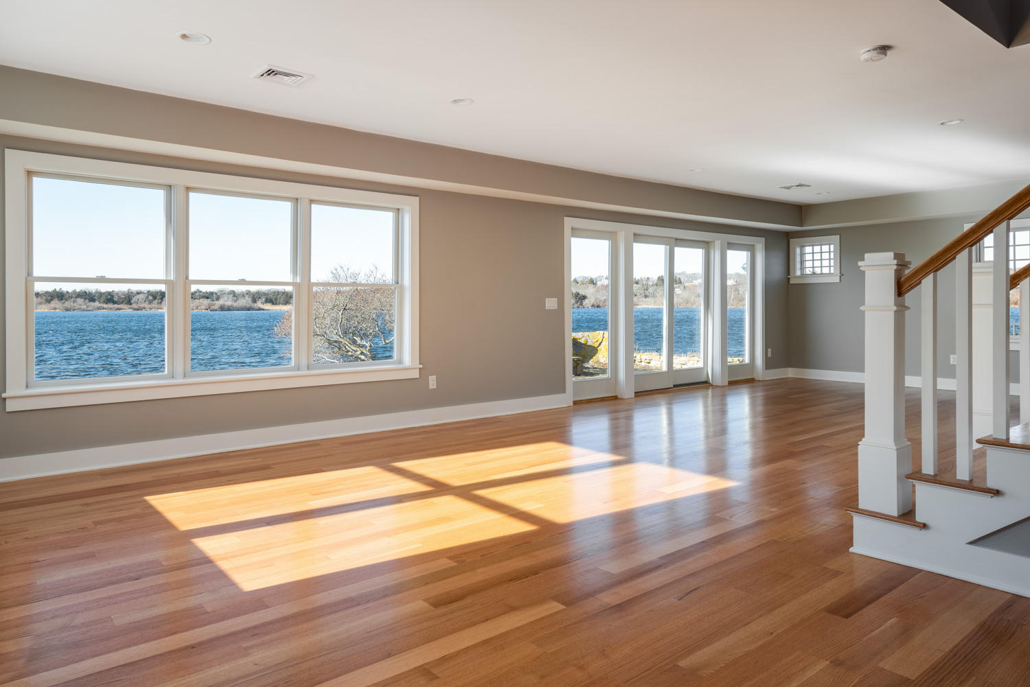 333 Mill Road Falmouth, MA 02540 - Photo 15 of 68 a view of an empty room with wooden floor and a window