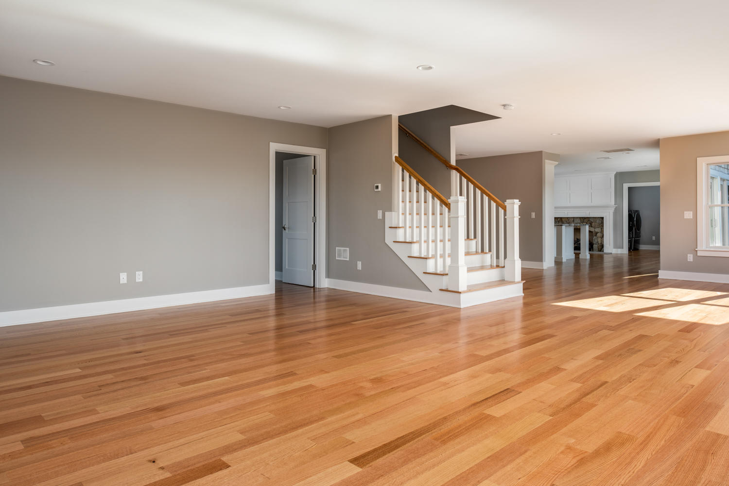 333 Mill Road Falmouth, MA 02540 - Photo 17 of 68 an empty room with wooden floor and windows
