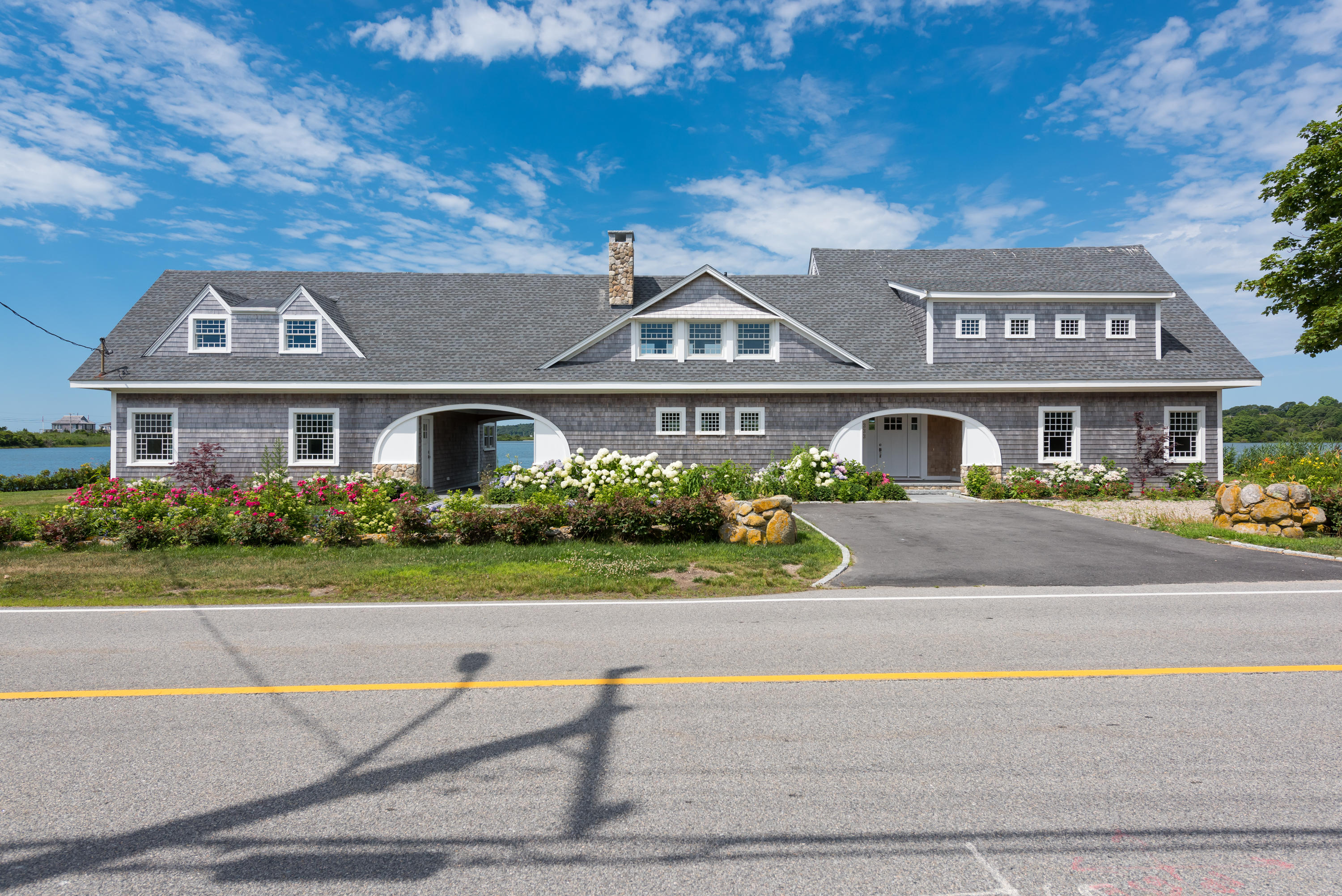333 Mill Road Falmouth, MA 02540 - Photo 2 of 68 front view of a house with a yard