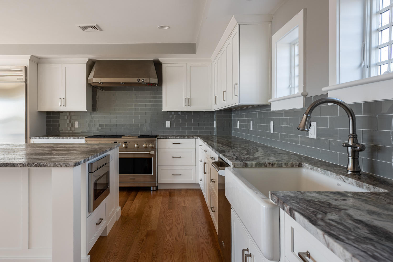 333 Mill Road Falmouth, MA 02540 - Photo 27 of 68 a kitchen with a stove a sink and a microwave