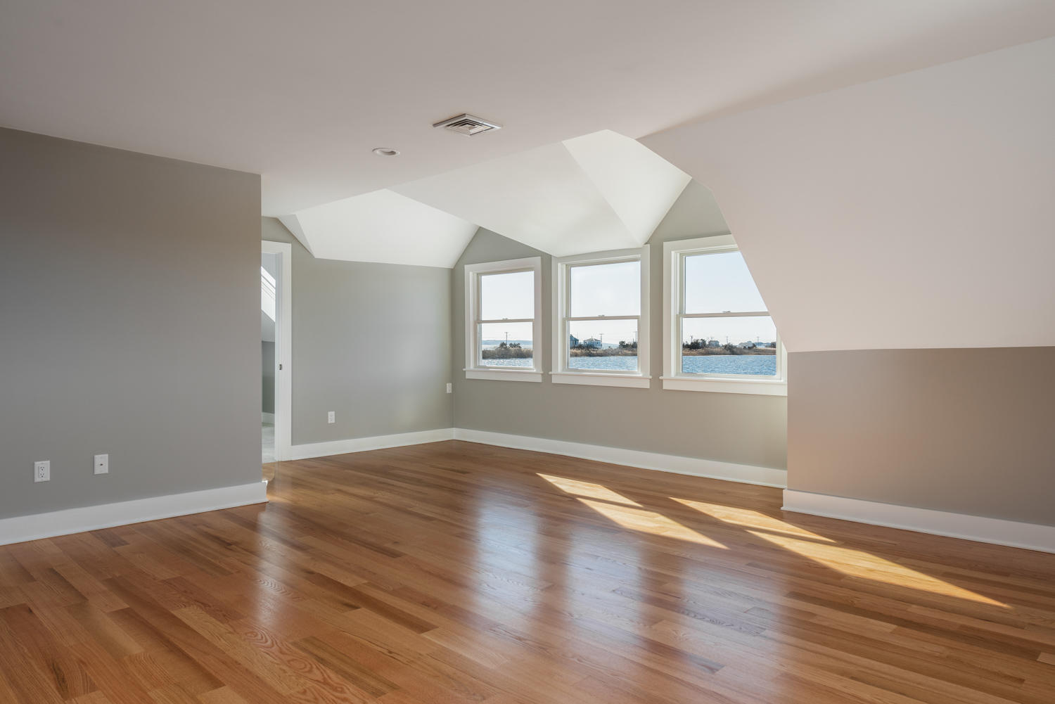 333 Mill Road Falmouth, MA 02540 - Photo 32 of 68 wooden floor in an empty room with a window