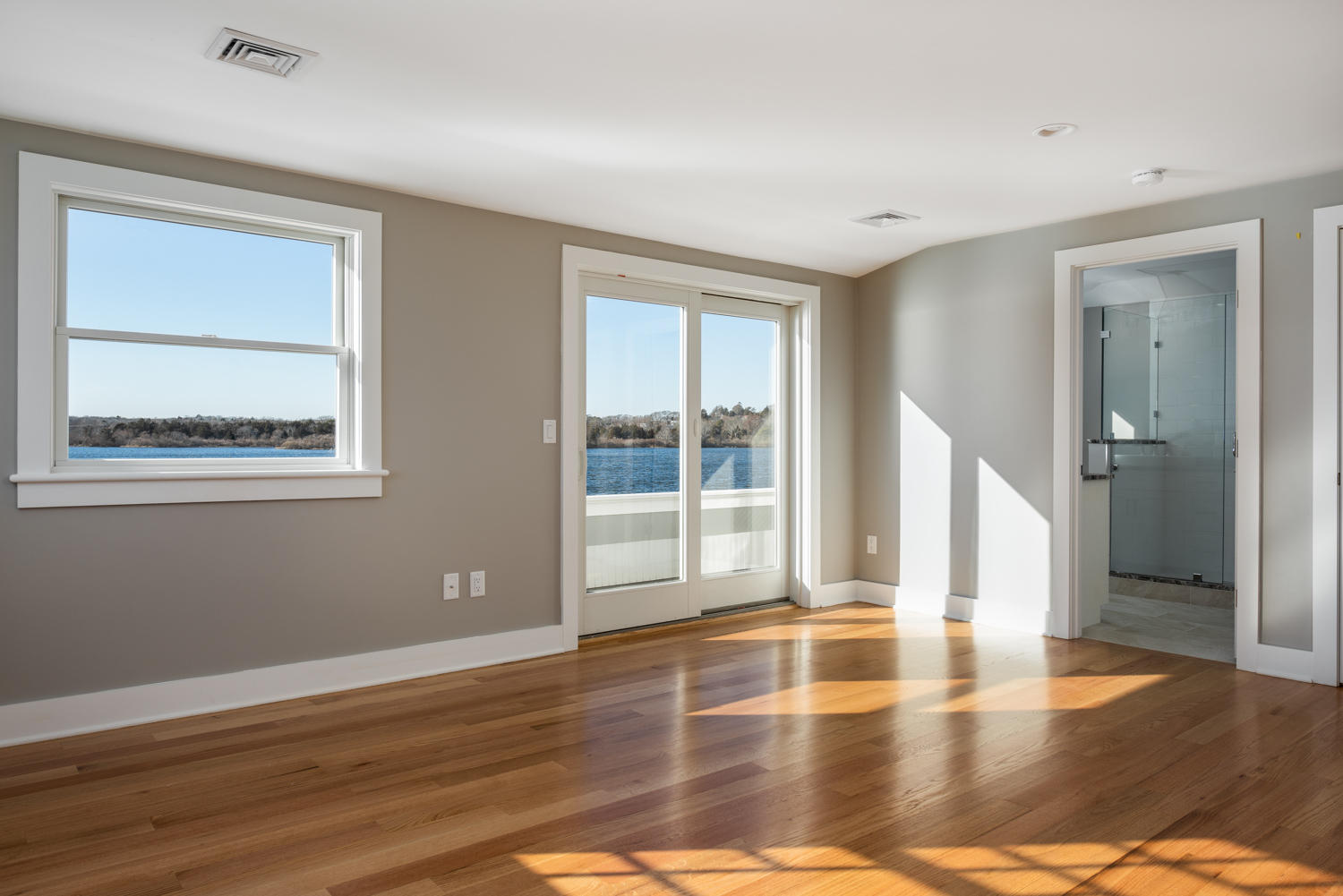 333 Mill Road Falmouth, MA 02540 - Photo 40 of 68 a view of empty room with wooden floor and fan