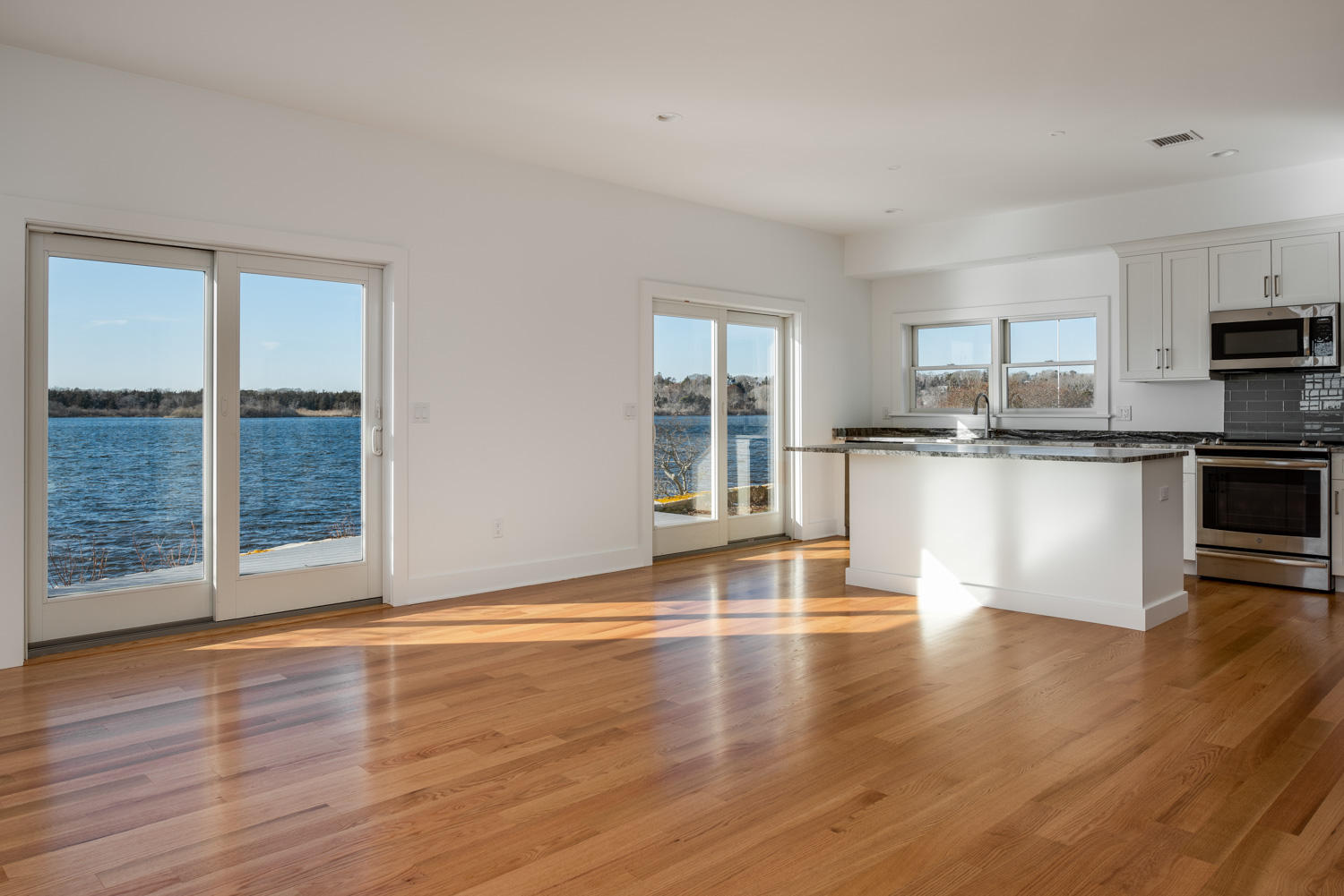 333 Mill Road Falmouth, MA 02540 - Photo 44 of 68 a view of kitchen with granite countertop window and wooden floor