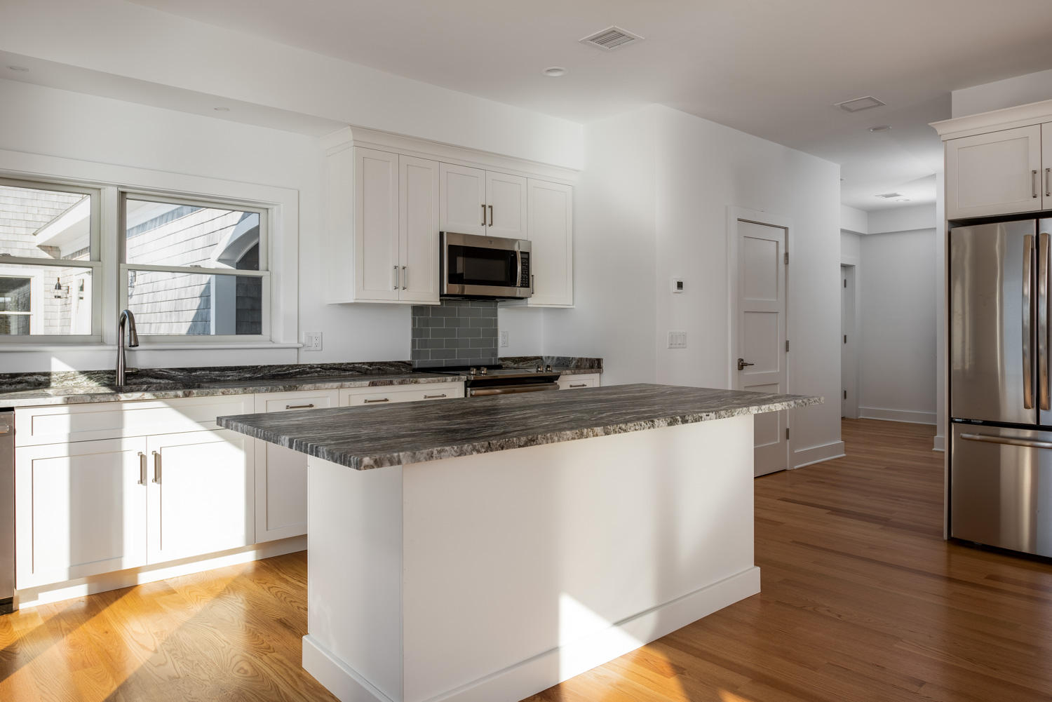 333 Mill Road Falmouth, MA 02540 - Photo 46 of 68 a kitchen with stainless steel appliances granite countertop a sink stove and refrigerator