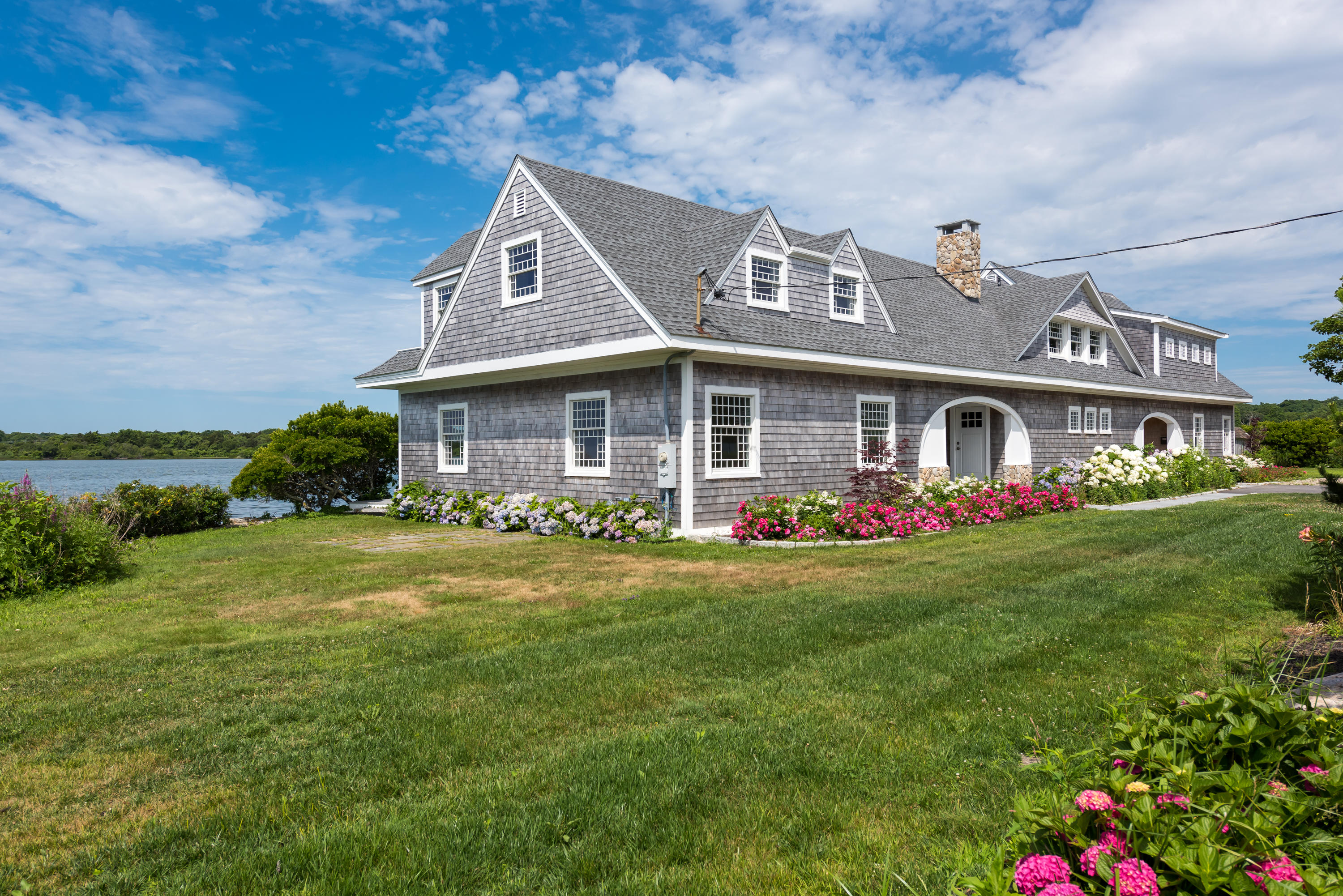 333 Mill Road Falmouth, MA 02540 - Photo 50 of 68 a front view of a house with garden