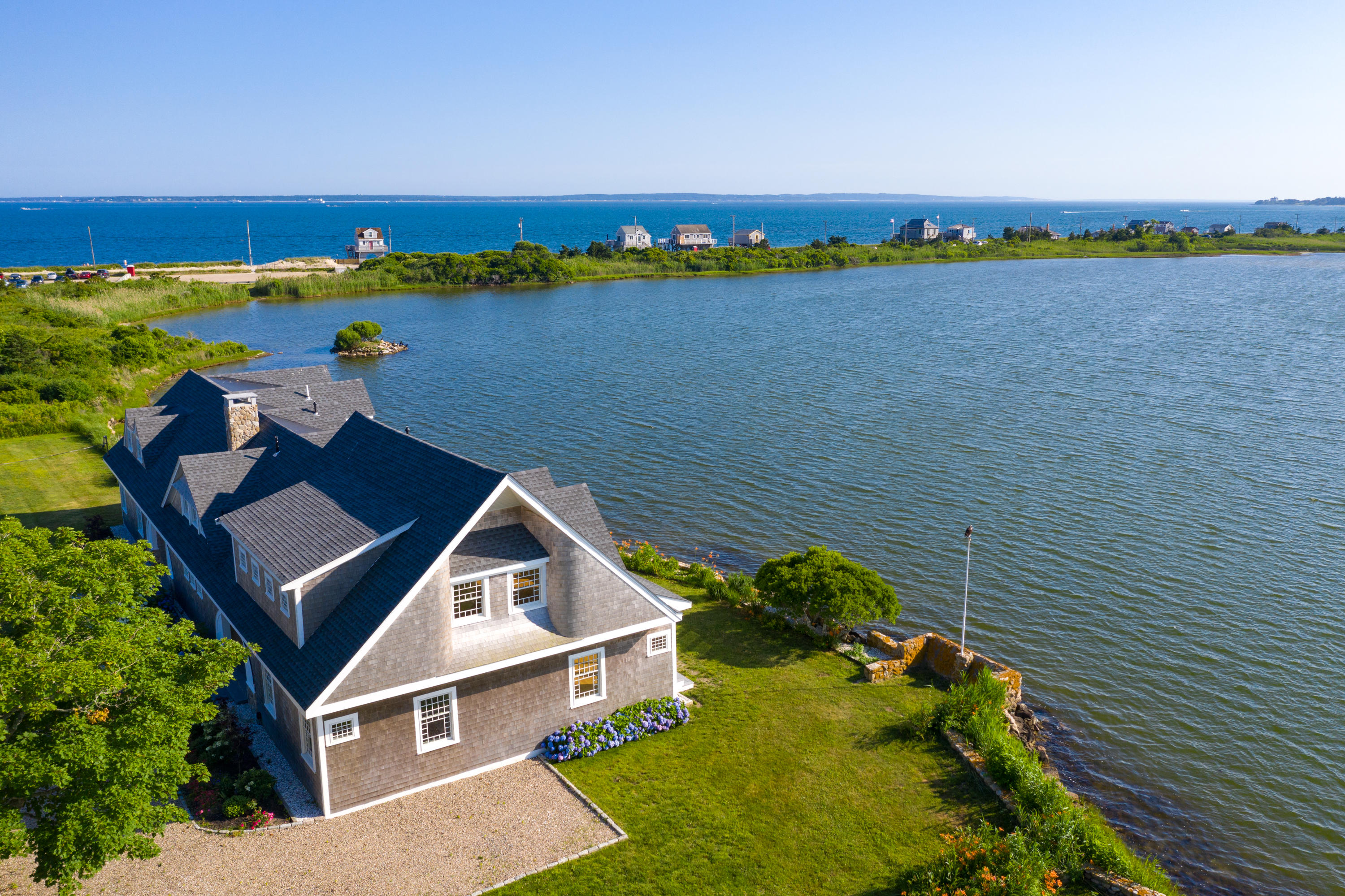333 Mill Road Falmouth, MA 02540 - Photo 66 of 68 an aerial view of a house with a lake view