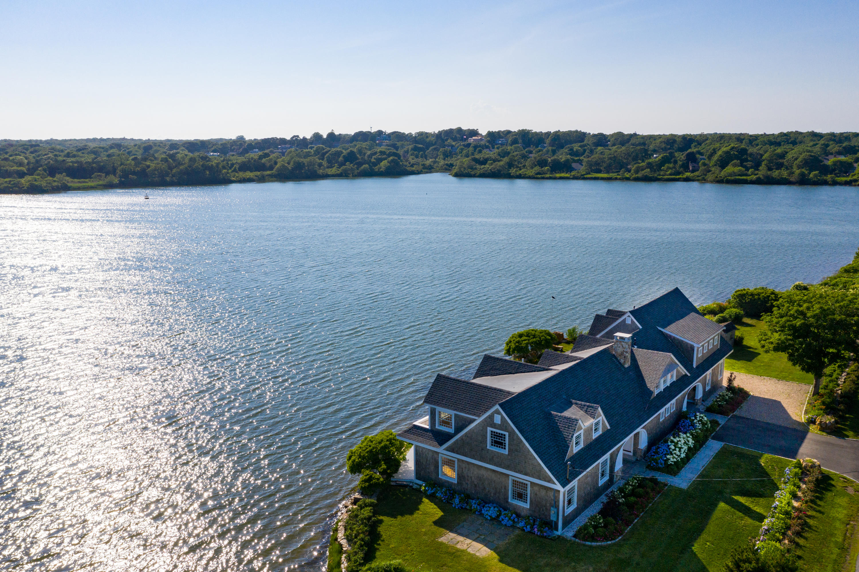 333 Mill Road Falmouth, MA 02540 - Photo 7 of 68 a view of a lake with a mountain in the background