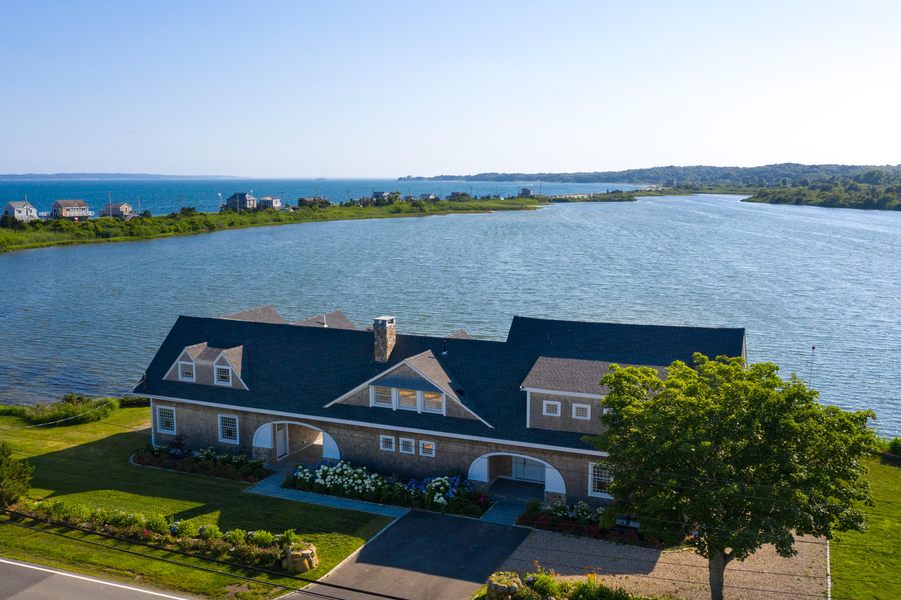 333 Mill Road Falmouth, MA 02540 - Photo 9 of 68 an aerial view of a house with a lake view