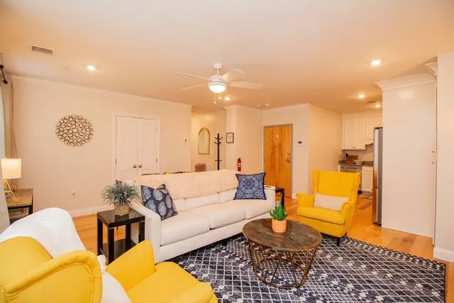 a living room with furniture and a rug