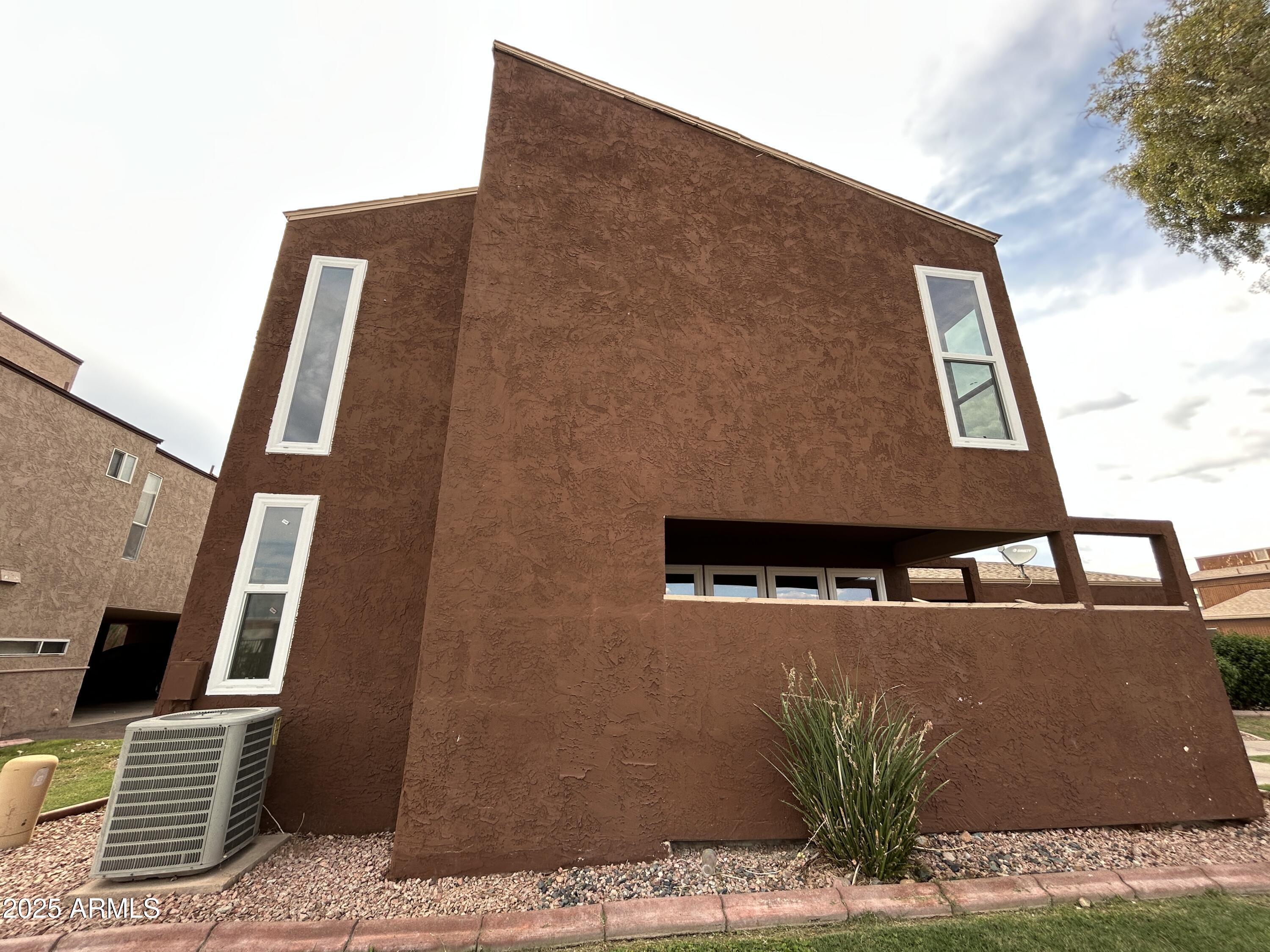 2699 East Silk Oak Drive Tempe, AZ 85288 - Photo 18 of 19 a front view of a house with plants