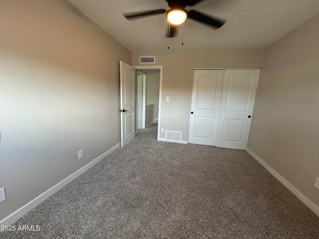 an empty room with fan