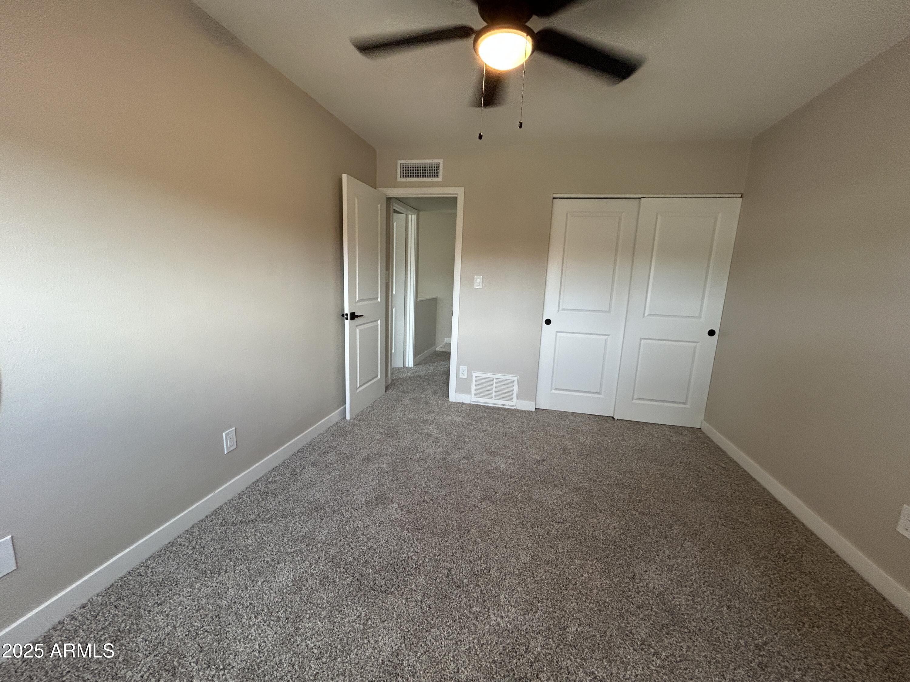 2699 East Silk Oak Drive Tempe, AZ 85288 - Photo 3 of 19 an empty room with fan