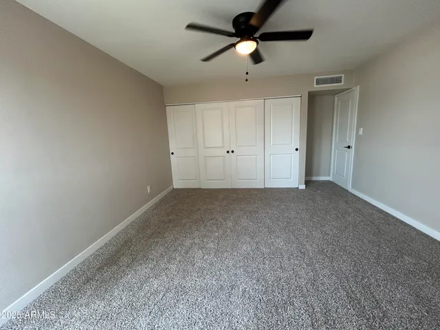 a view of a big room with carpet