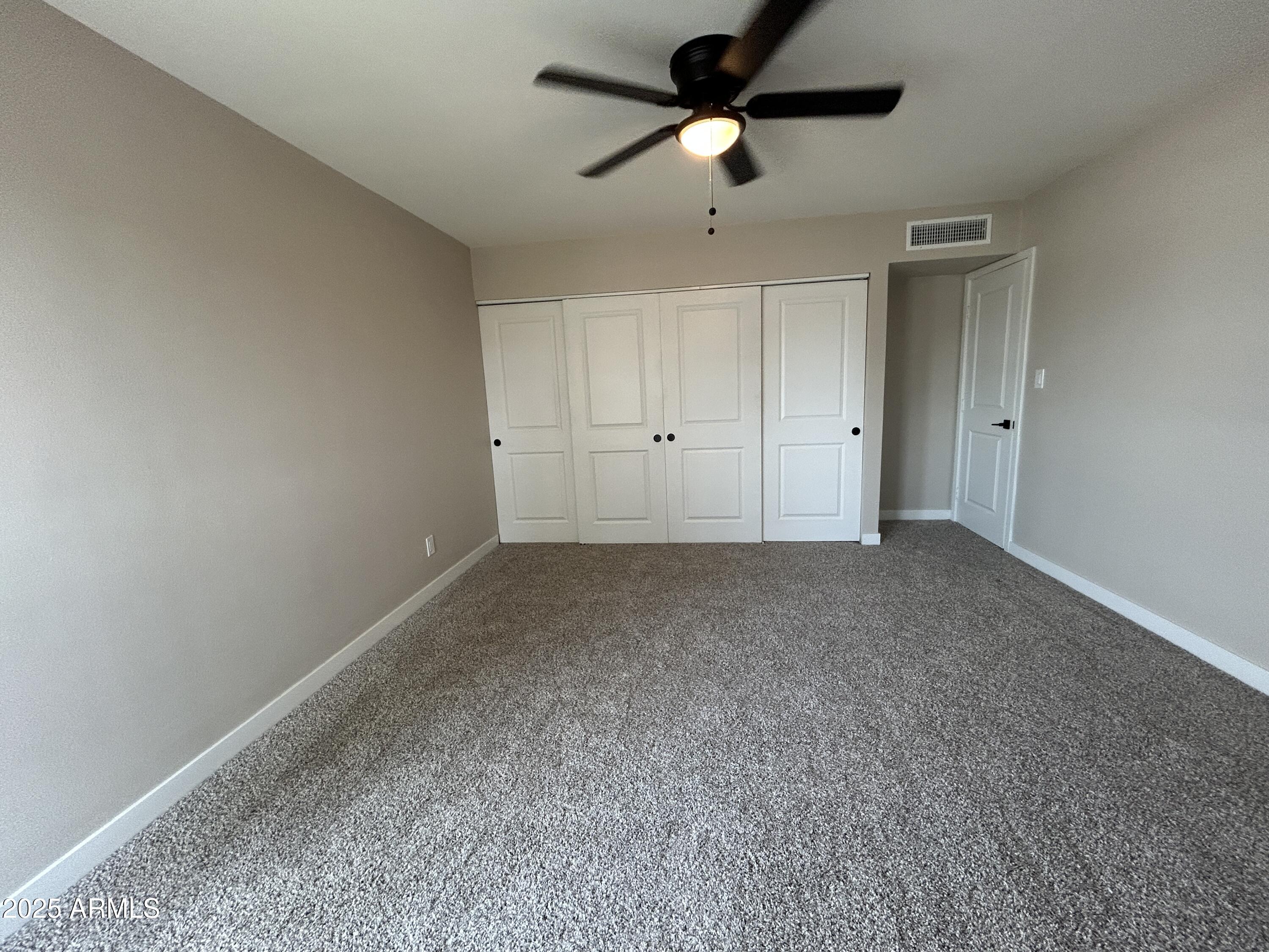 2699 East Silk Oak Drive Tempe, AZ 85288 - Photo 7 of 19 a view of a big room with carpet