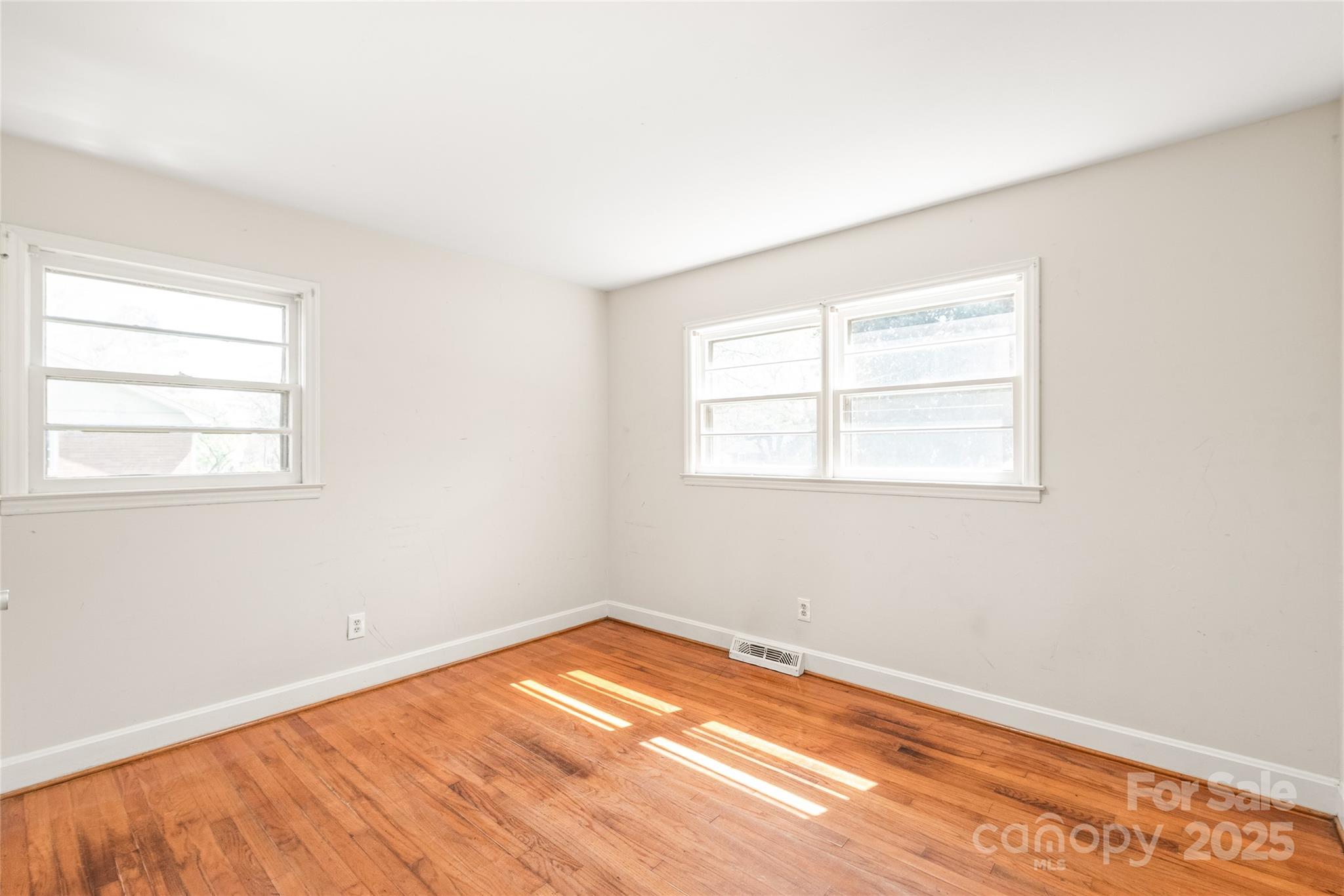7207 Idlewild Road Charlotte, NC 28212 - Photo 12 of 15 an empty room with a window