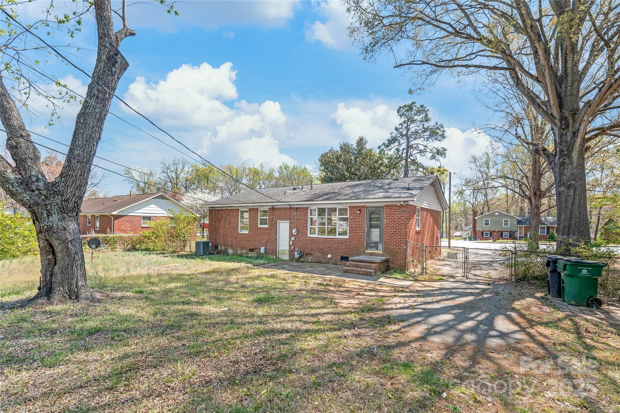 7207 Idlewild Road Charlotte, NC 28212 - Photo 14 of 15 a view of a house with a yard covered in snow