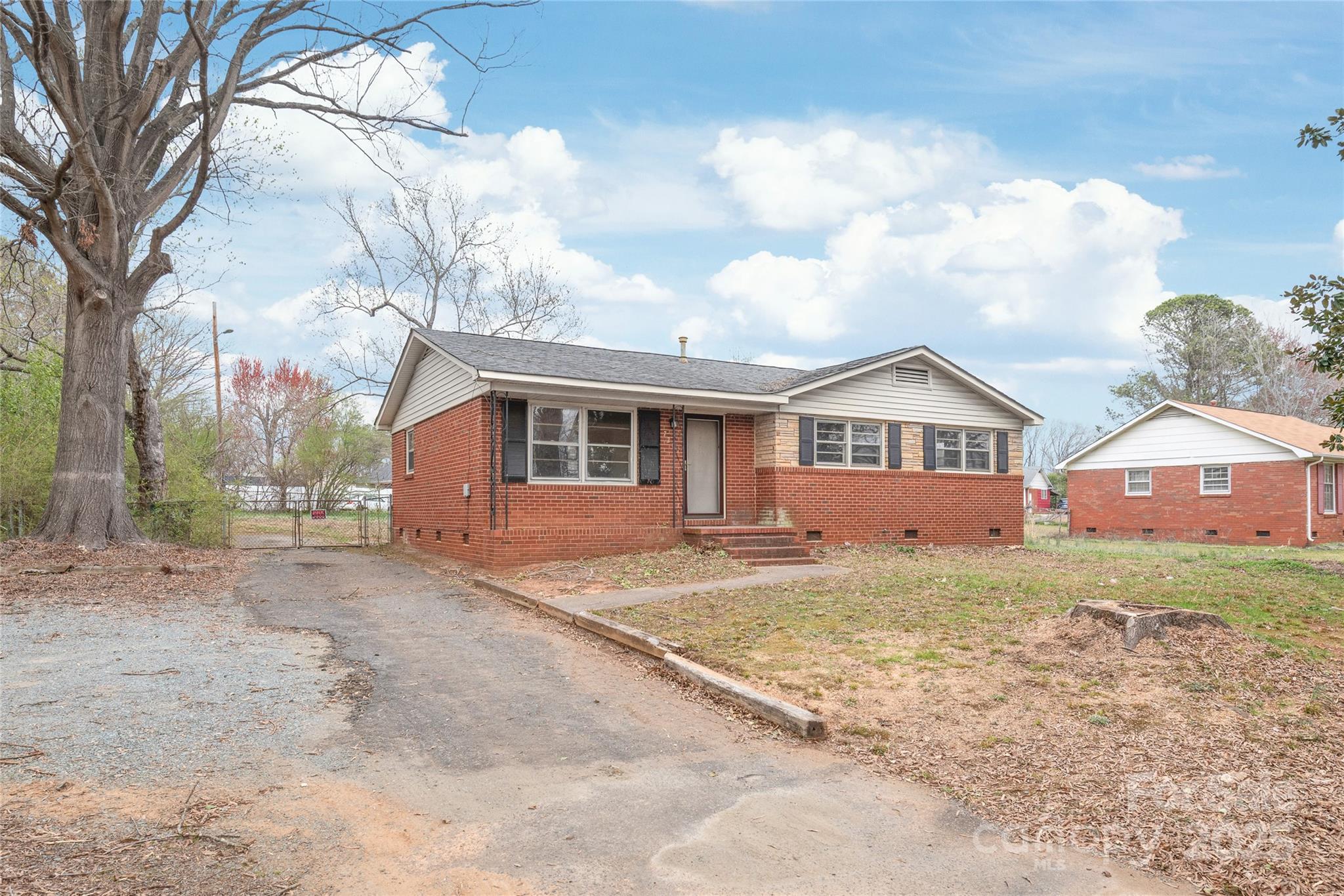 7207 Idlewild Road Charlotte, NC 28212 - Photo 2 of 15 a view of front of a house with a yard