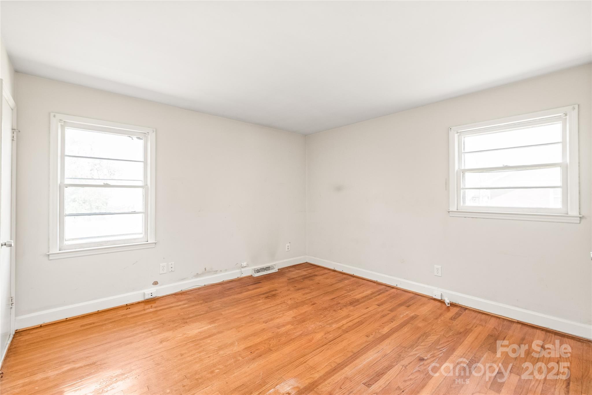 7207 Idlewild Road Charlotte, NC 28212 - Photo 8 of 15 an empty room with a window