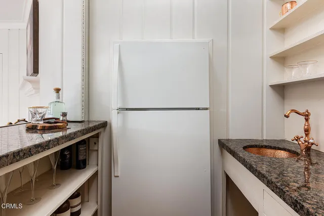 a balcony with wooden floor and fence