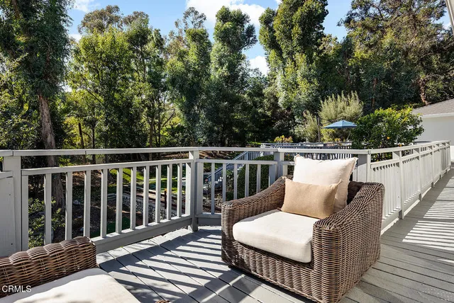 a large kitchen with stainless steel appliances granite countertop a large stove a sink and a refrigerator