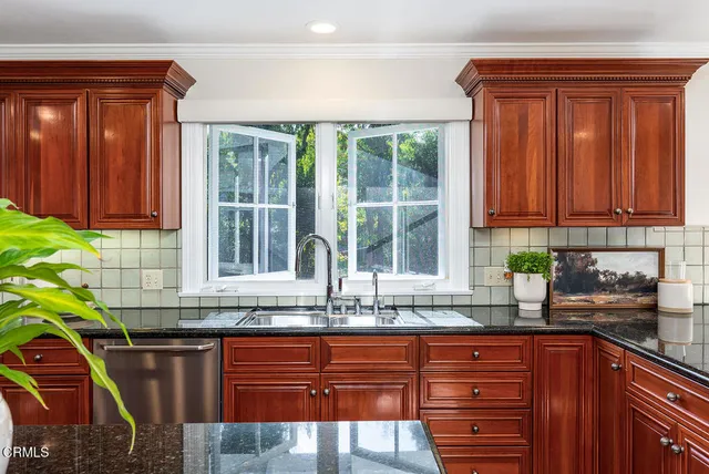 a bedroom with a large bed and a couch