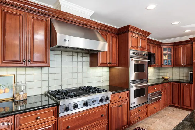 a bedroom with a bed and glass window