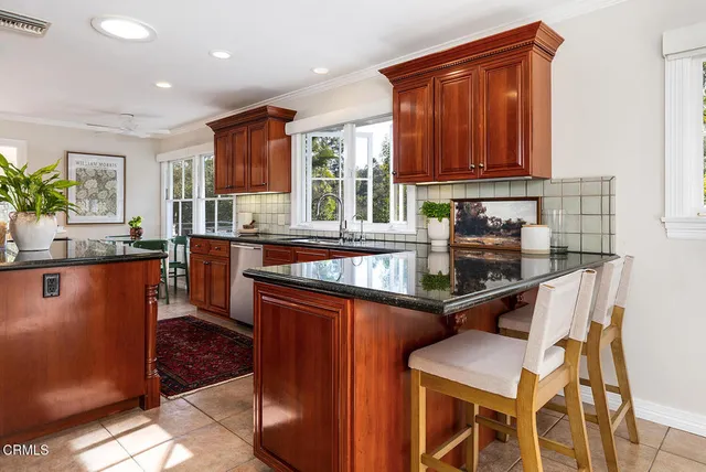 a spacious bathroom with double sink and a large mirror