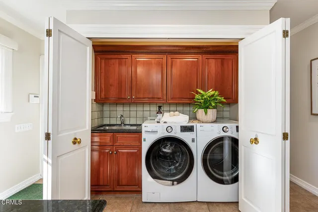 a bedroom with a bed window and a table