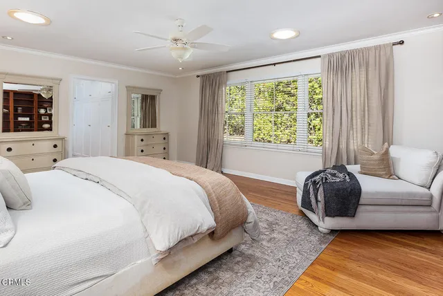 a en suite bathroom with a granite countertop sink and a mirror
