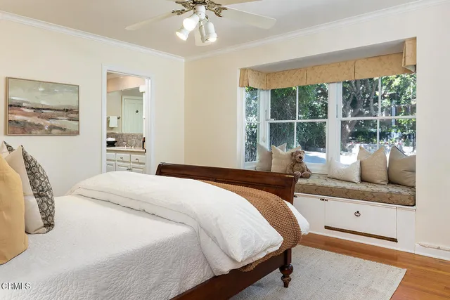 a patio with patio a table and chairs under an umbrella